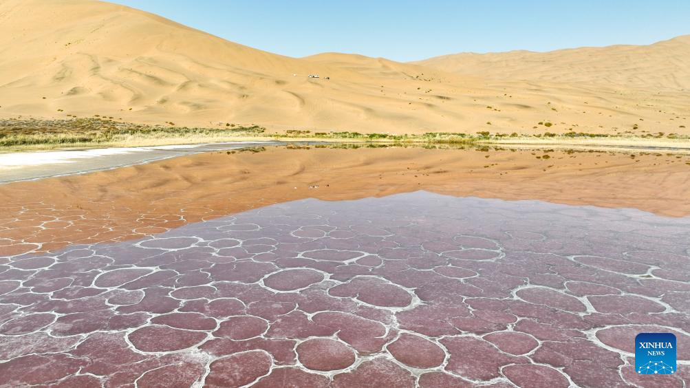 A drone photo taken on Oct. 22, 2025 shows a lake in the Badain Jaran Desert in Alxa Right Banner, the Alxa League of north China's Inner Mongolia Autonomous Region. The Badain Jaran Desert was included on the World Heritage List in July 2024. (Xinhua/Bei He)